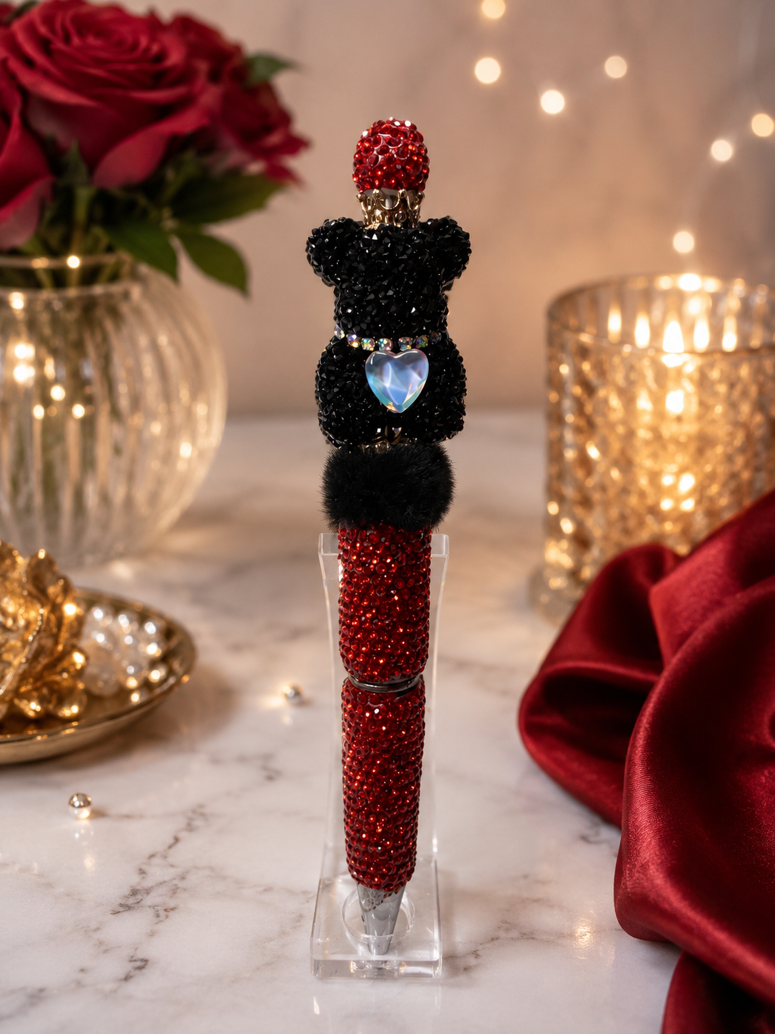 Red beaded pen with black bear