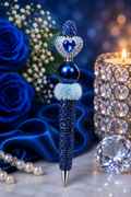 Blue beaded pen with sequin heart