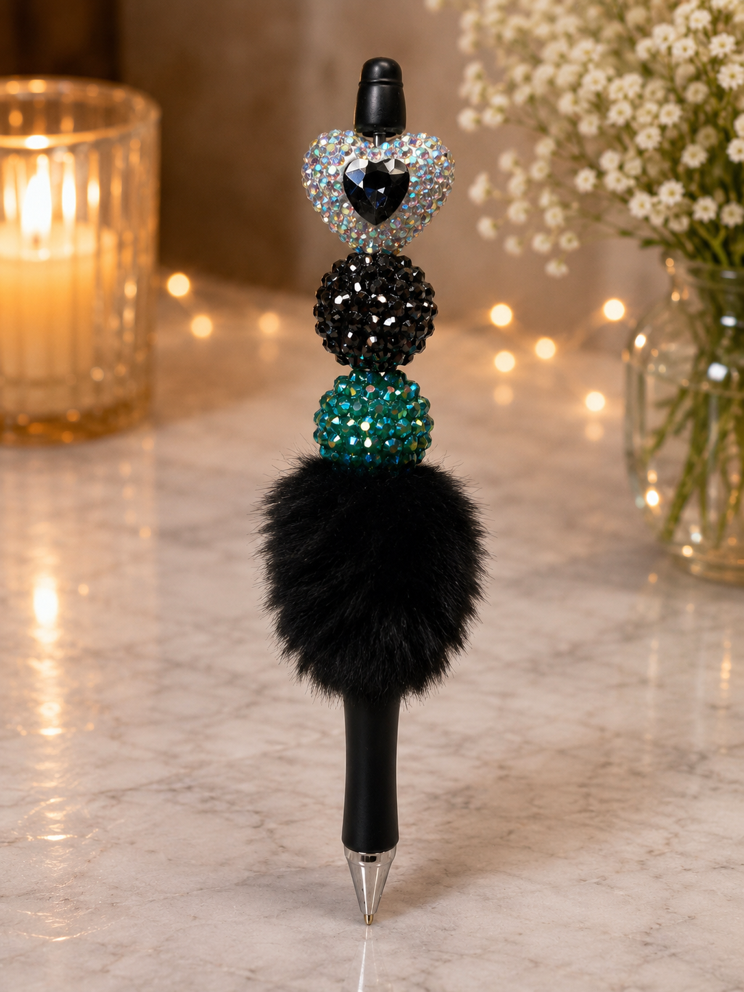 Black furry pen with teal focal bead